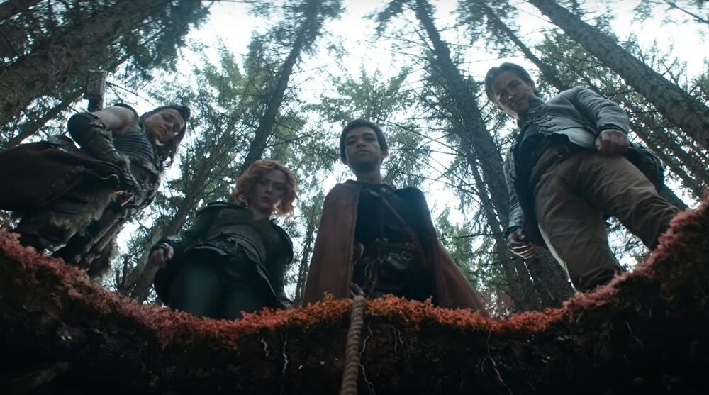 Equipo de Calabozos y Dragones viendo a un agujero en el suelo