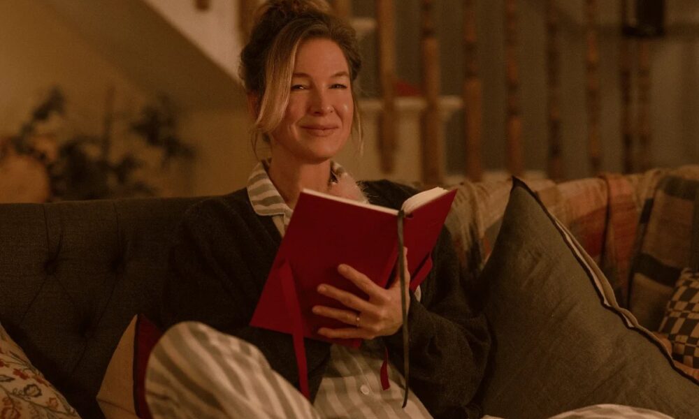 bridget jones sentada leyendo un libro